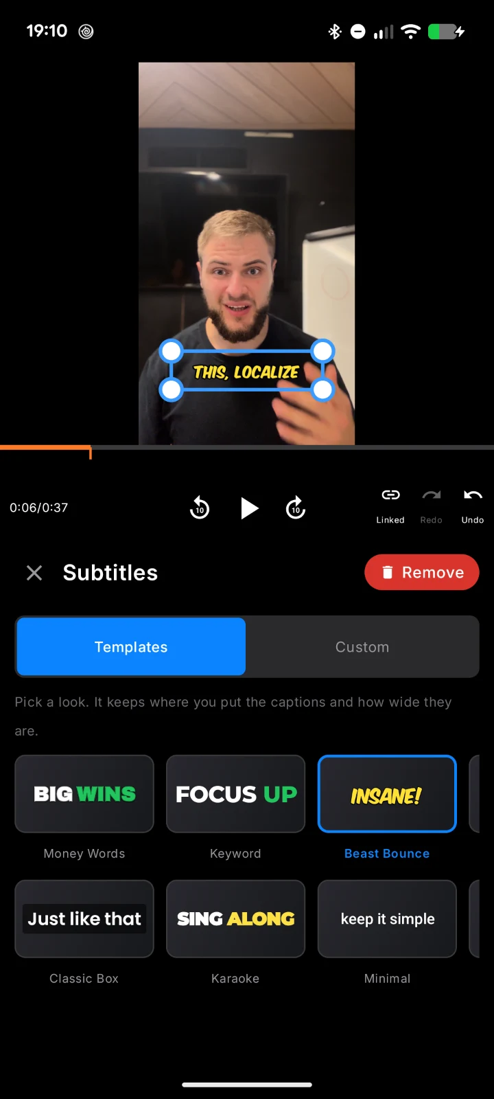 BlitzCut subtitles panel on iPhone with caption templates Money Words, Keyword, Beast Bounce, Classic Box, Karaoke, and Minimal, and a Beast Bounce caption selected on a talking-head Short